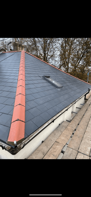 Slate roof replacement with new ridge tiles