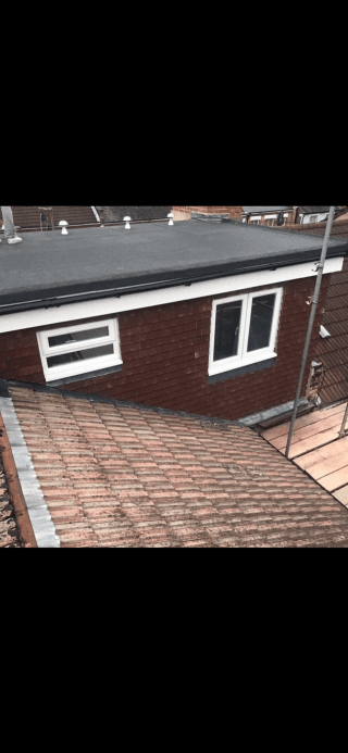 Flat roof extension on brick terrace house