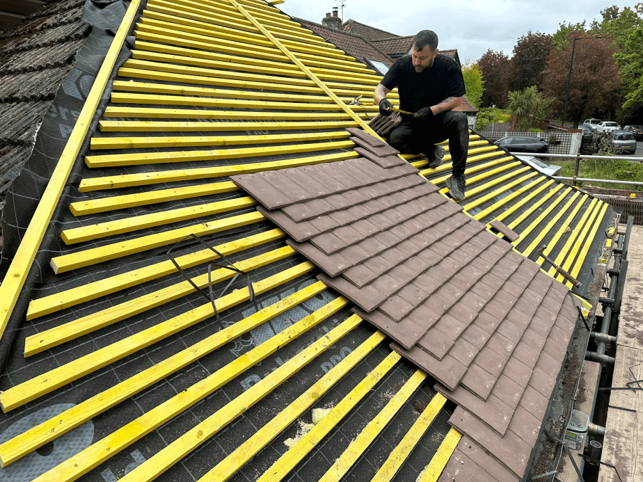 New roof battening and tile laying in progress