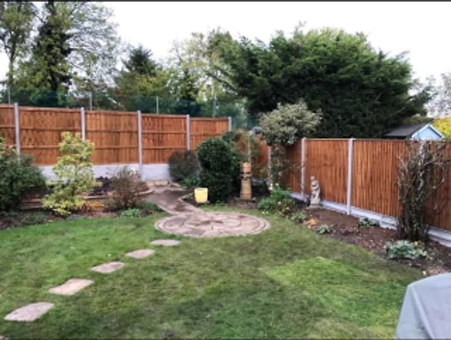 Full garden fencing with lawn and borders